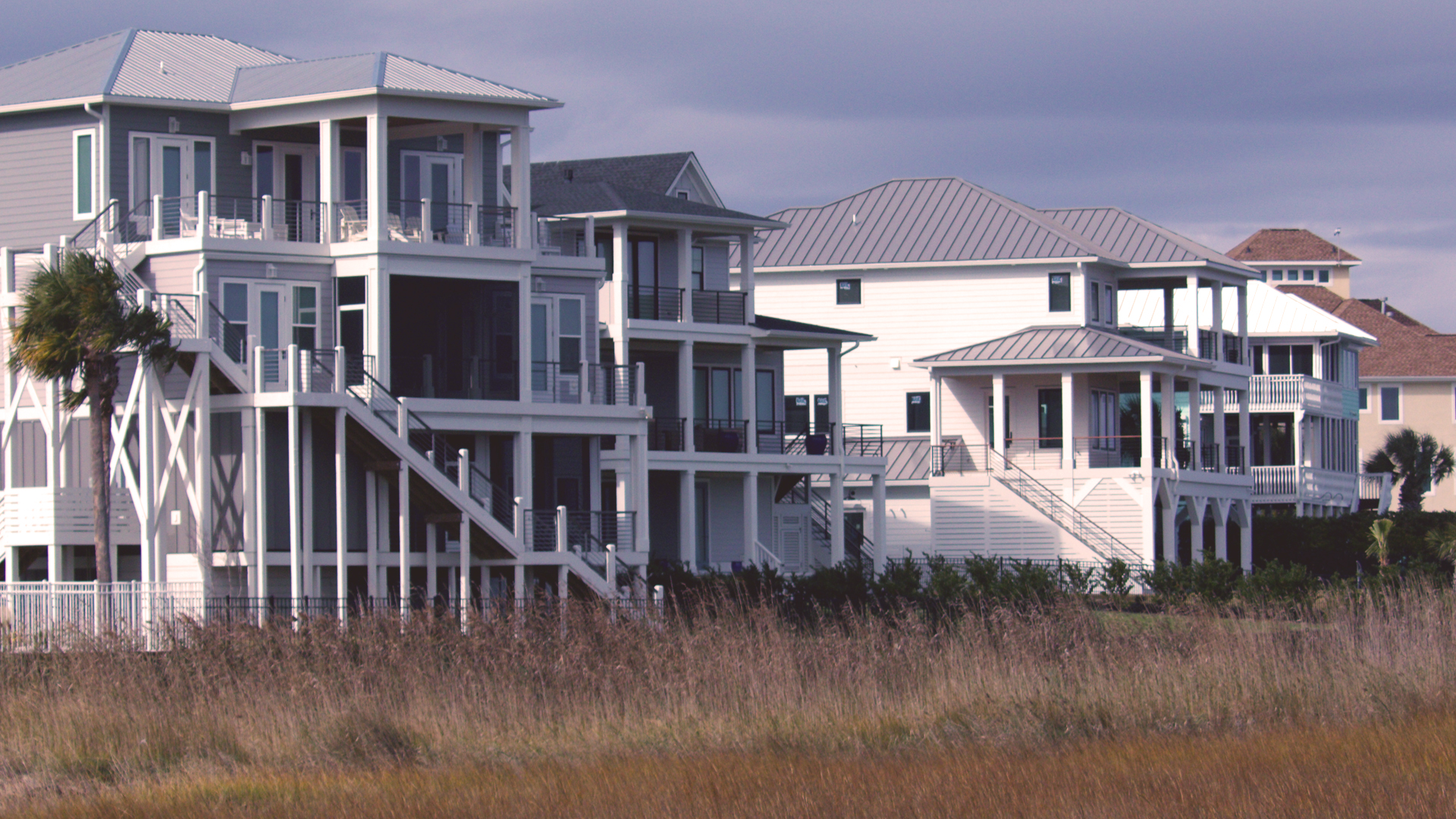 Mansions lining a salt water marsh